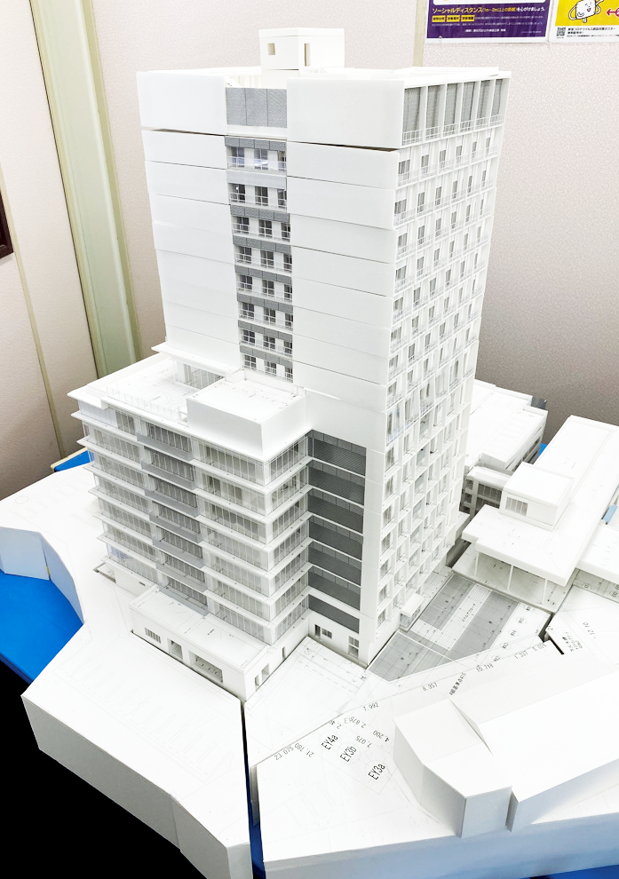 株式会社屋部土建 現在施工中のオフィスタワー「ゆがふBizタワー浦添港川」（地上17階、地下1階）のイメージ。屋部土建本社も1フロアに移転予定（2022年10月頃竣工予定）。